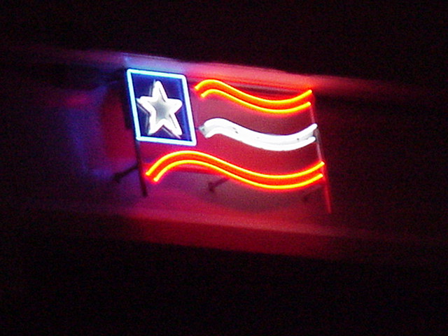 Kemah side neon flag on 146 bridge photo