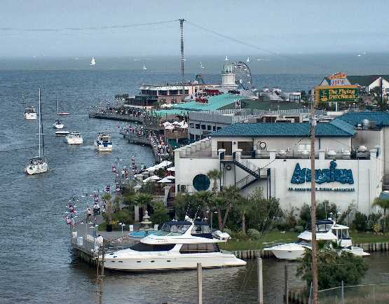 Boats tied up at the Kemah Boardwalk Boardwalk along side the famous Aquriam Resturant in Kemah Texas